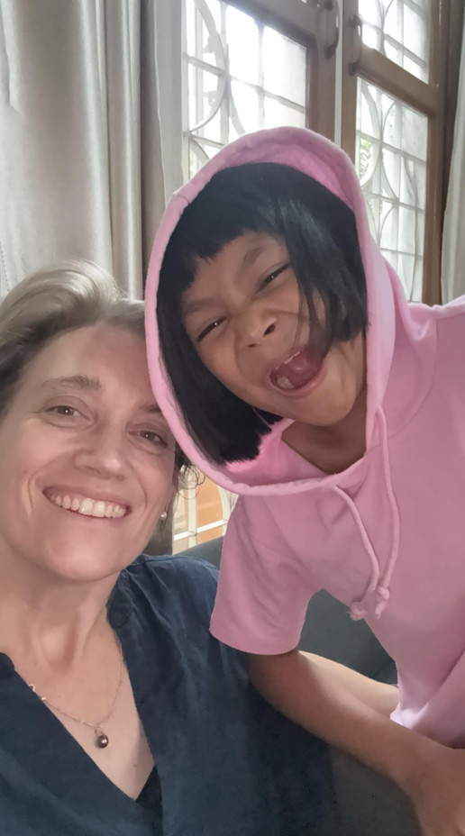 Happy mother and daughter smiling